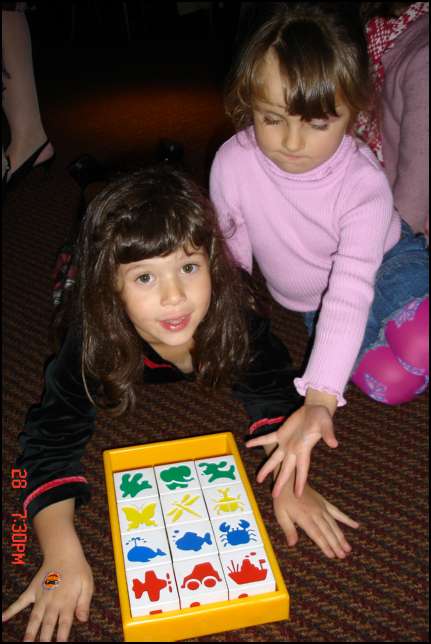 Sydney and Valentina playing with a puzzle
