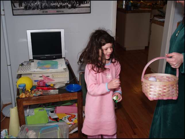 Sydney is collecting the eggs in a basket.....