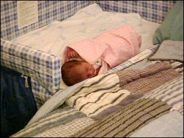 Sleeping next to Mommy and Daddy in the co-sleeper