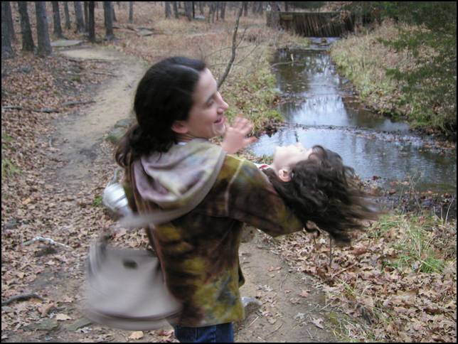 Laura is spinning me around on a hike at Woolaroc