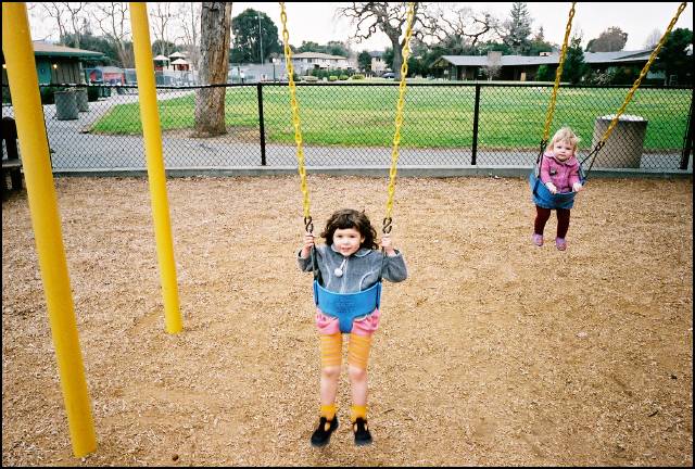 Sydney is swinging --- swinging on the swing!