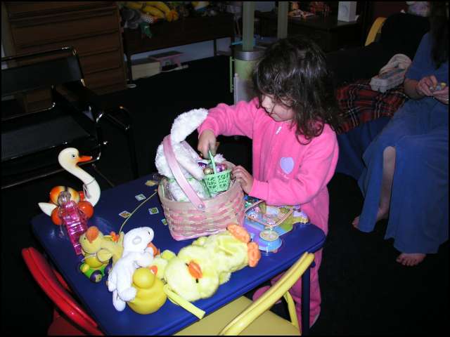 An easter bunny with a basket of chocolate eggs