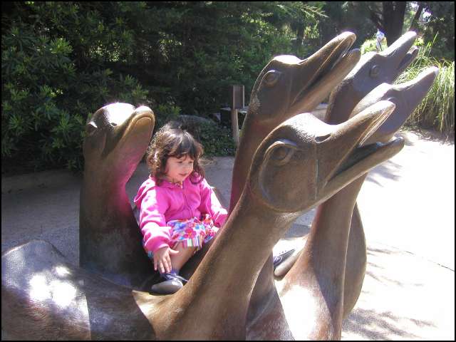 Pretending to ride the swans