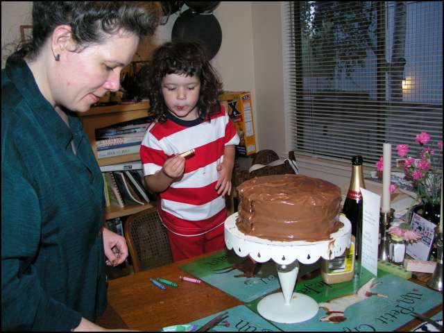 Putting candles on Jay's B-day cake
