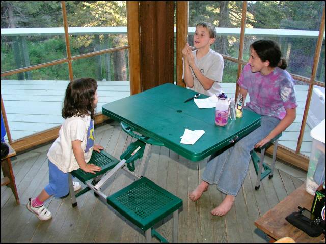 Carig doing magic tricks for Sydney and Laura