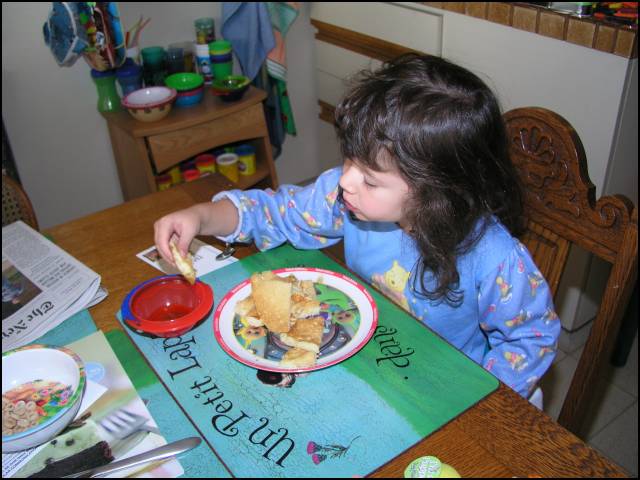 Dip the pancake into the syrup