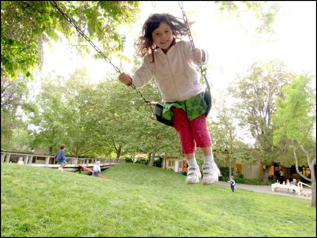 Look how high I can swing -- higher than Daddy!