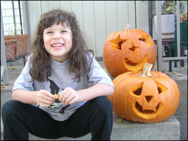 Sydney had fun carving pumpkins for Halloween.