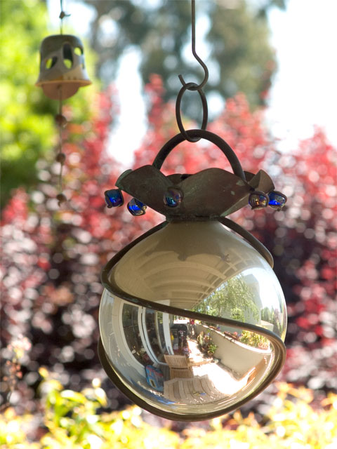 Mirrored glob to keep bad spirits away