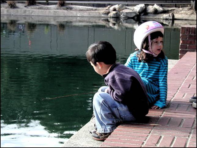 The had a great time trying to catch the carp in the pond