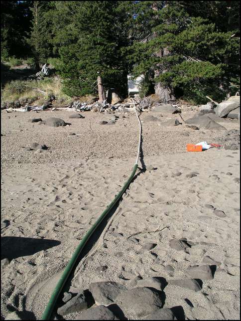 Two inch 25 foot discharge hose going to the PVC pipe and then to the base pump.