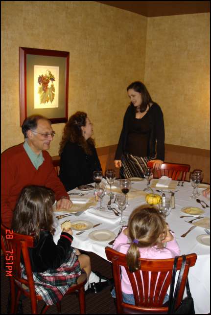Linda talking with Michelle and Sydney sitting between Daddy and Valentina