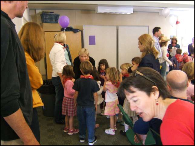 Sydney had a purple name tag so she goes to the teacher with a puple ballon for a tour of the kindergarten classrooms
