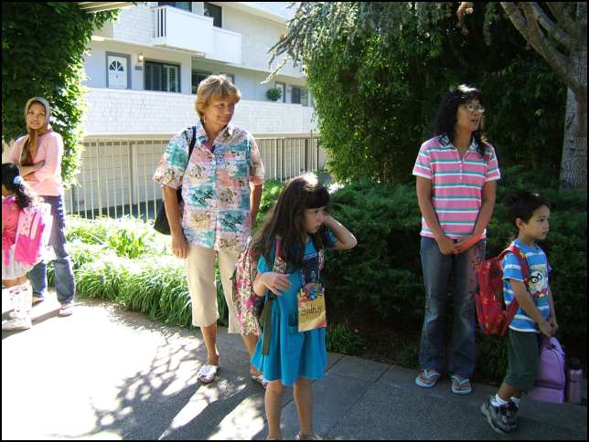Waiting for the bus in front of Sharon Glen